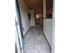 Inviting entryway with unique ceiling leads to a kitchen with natural light at 4700 Neptune Rd, Venice, FL 34293