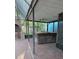 Covered hot tub with a ceiling fan, located on a brick patio within a screened-in enclosure at 4700 Neptune Rd, Venice, FL 34293