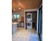 Kitchen area featuring a stacked washer and dryer hidden in the closet at 4700 Neptune Rd, Venice, FL 34293