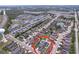 Aerial view of community highlights the houses and natural surroundings of lakes and green space at 4826 San Ortebello Dr, Bradenton, FL 34208