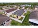 Aerial view of home showing the fenced yard, lush landscaping, proximity to lake, and the surrounding neighborhood at 4826 San Ortebello Dr, Bradenton, FL 34208