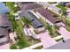 Aerial view of charming single Gathering home with fenced backyard, lush green lawn, palm trees, and a two-car garage at 4826 San Ortebello Dr, Bradenton, FL 34208