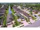 Aerial view of neighborhood with waterfront views and palm tree landscaping at 4826 San Ortebello Dr, Bradenton, FL 34208