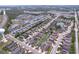 Expansive aerial view showcases a well-maintained community with ponds, green spaces, and organized street layout at 4826 San Ortebello Dr, Bradenton, FL 34208
