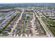 An aerial view showcases a neighborhood featuring homes near a waterway at 4826 San Ortebello Dr, Bradenton, FL 34208