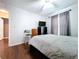 Bright bedroom with wood floors, ceiling fan, curtains, and ample natural light at 4826 San Ortebello Dr, Bradenton, FL 34208