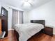 Inviting bedroom showcasing wood floors, a ceiling fan, and a comfortable bed at 4826 San Ortebello Dr, Bradenton, FL 34208