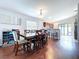 Open dining area featuring hardwood floors, modern lighting, and seamless access to the kitchen at 4826 San Ortebello Dr, Bradenton, FL 34208