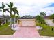 Charming single-Gathering home with lush landscaping and a well-manicured lawn, creating great curb appeal at 4826 San Ortebello Dr, Bradenton, FL 34208