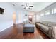 Bright living room featuring hardwood floors, a ceiling fan, and comfortable seating arrangements at 4826 San Ortebello Dr, Bradenton, FL 34208
