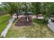 Aerial view of a playground with slides in a green and shady area at 4826 San Ortebello Dr, Bradenton, FL 34208