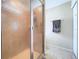 Walk-in shower featuring glass door and tile surround at 4826 San Ortebello Dr, Bradenton, FL 34208
