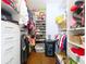 Spacious walk-in closet features built-in shelving and racks for ample storage at 4826 San Ortebello Dr, Bradenton, FL 34208