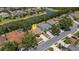 An aerial view of a home featuring a pool and lush landscaping in a waterfront community at 4926 72Nd E St, Bradenton, FL 34203