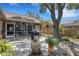 Beautiful backyard featuring a screened lanai, landscaping, and stone pavers at 4926 72Nd E St, Bradenton, FL 34203