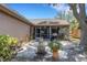 Exterior view of the house with a stone paver patio and a screened-in porch at 4926 72Nd E St, Bradenton, FL 34203