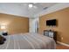 Comfortable bedroom featuring warm yellow walls and wood laminate flooring at 4926 72Nd E St, Bradenton, FL 34203
