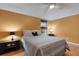 Comfortable bedroom featuring warm yellow walls and wood laminate flooring at 4926 72Nd E St, Bradenton, FL 34203