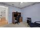 Comfortable bedroom, designed as a home office, with blue walls and carpeted floors at 4926 72Nd E St, Bradenton, FL 34203