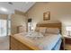 Comfortable bedroom with wood accents, neutral walls, and a decorative quilt at 4926 72Nd E St, Bradenton, FL 34203