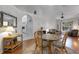 Open-concept dining area featuring a round table with views into kitchen and living spaces, ideal for modern living at 4926 72Nd E St, Bradenton, FL 34203
