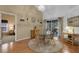Cozy dining area with round table, hardwood floors and sliding door leading to the outdoor area, creating a warm atmosphere at 4926 72Nd E St, Bradenton, FL 34203
