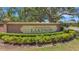Creekwood Lakeside entrance sign featuring manicured landscaping, and accent lighting at 4926 72Nd E St, Bradenton, FL 34203