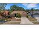 Well-manicured landscaping frames the front of this single-story home, highlighting its curb appeal at 4926 72Nd E St, Bradenton, FL 34203