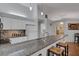 Modern kitchen featuring a granite breakfast bar, stainless steel appliances, and a seamless flow into adjacent living spaces at 4926 72Nd E St, Bradenton, FL 34203