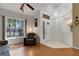 Inviting space with hardwood floors, large window, and view of the front entrance with tile at 4926 72Nd E St, Bradenton, FL 34203