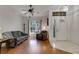 Bright living room with hardwood floors, large window and comfortable seating, perfect for relaxing or entertaining guests at 4926 72Nd E St, Bradenton, FL 34203
