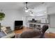 Bright and open-concept living room with hardwood floors and a view of the kitchen at 4926 72Nd E St, Bradenton, FL 34203