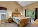 Inviting main bedroom with natural light and access to outdoor lanai at 4926 72Nd E St, Bradenton, FL 34203