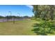 Lawn area with a volleyball net and a view of the pond at Creekwood Lakeside at 4926 72Nd E St, Bradenton, FL 34203
