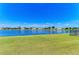Picturesque lake view behind a manicured lawn creating an ideal setting for relaxation at 5102 98Th E Ave, Parrish, FL 34219