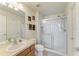 Clean bathroom with a glass-enclosed shower, neutral walls, and a single sink vanity at 5102 98Th E Ave, Parrish, FL 34219