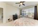 Well-lit bedroom with ceiling fan, a lake view, neutral walls and decor at 5102 98Th E Ave, Parrish, FL 34219
