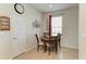 Cozy breakfast nook featuring tile floors, a round table, and a decorative tree wall art at 5102 98Th E Ave, Parrish, FL 34219