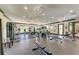 Large community gym featuring modern exercise equipment, rubber floors, and multiple ceiling fans at 5102 98Th E Ave, Parrish, FL 34219