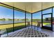 Inviting screened lanai with tranquil lake views and patio; perfect for relaxing or entertaining at 5102 98Th E Ave, Parrish, FL 34219