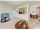 Inviting living room showing the kitchen, dining area, and neutral colored walls and flooring at 5102 98Th E Ave, Parrish, FL 34219