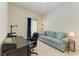 Home office space with desk, carpeted floor, couch, lamp, and natural light at 5102 98Th E Ave, Parrish, FL 34219