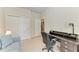 Home office space with desk, office chair, carpeted floor, and view to kitchen at 5102 98Th E Ave, Parrish, FL 34219
