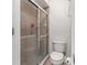 This bathroom has tiled shower and toilet at 5955 Ferendina St, North Port, FL 34291