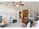 This bedroom has ceiling fan, an array of fishing rods, and built-in storage cabinet at 5955 Ferendina St, North Port, FL 34291
