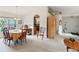 Cozy dining area featuring natural light and seamless flow to the living room at 5955 Ferendina St, North Port, FL 34291