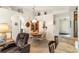 Cozy dining room with seamless flow to the entryway and a peek into the kitchen at 5955 Ferendina St, North Port, FL 34291