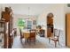 Bright dining area features a large window and convenient access to the kitchen at 5955 Ferendina St, North Port, FL 34291