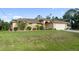 Charming home with a well-manicured lawn, a two-car garage, and beautiful landscaping at 5955 Ferendina St, North Port, FL 34291