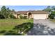 Charming single-Gathering home with lush front lawn and well-maintained landscaping at 5955 Ferendina St, North Port, FL 34291
